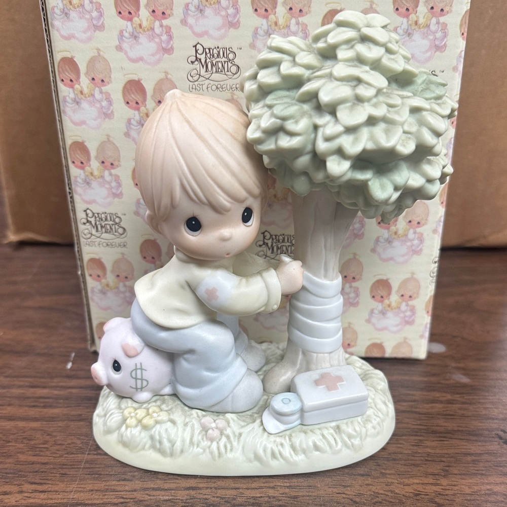 Precious Moments Child with Tree and Piggy Bank Figurine comes with box